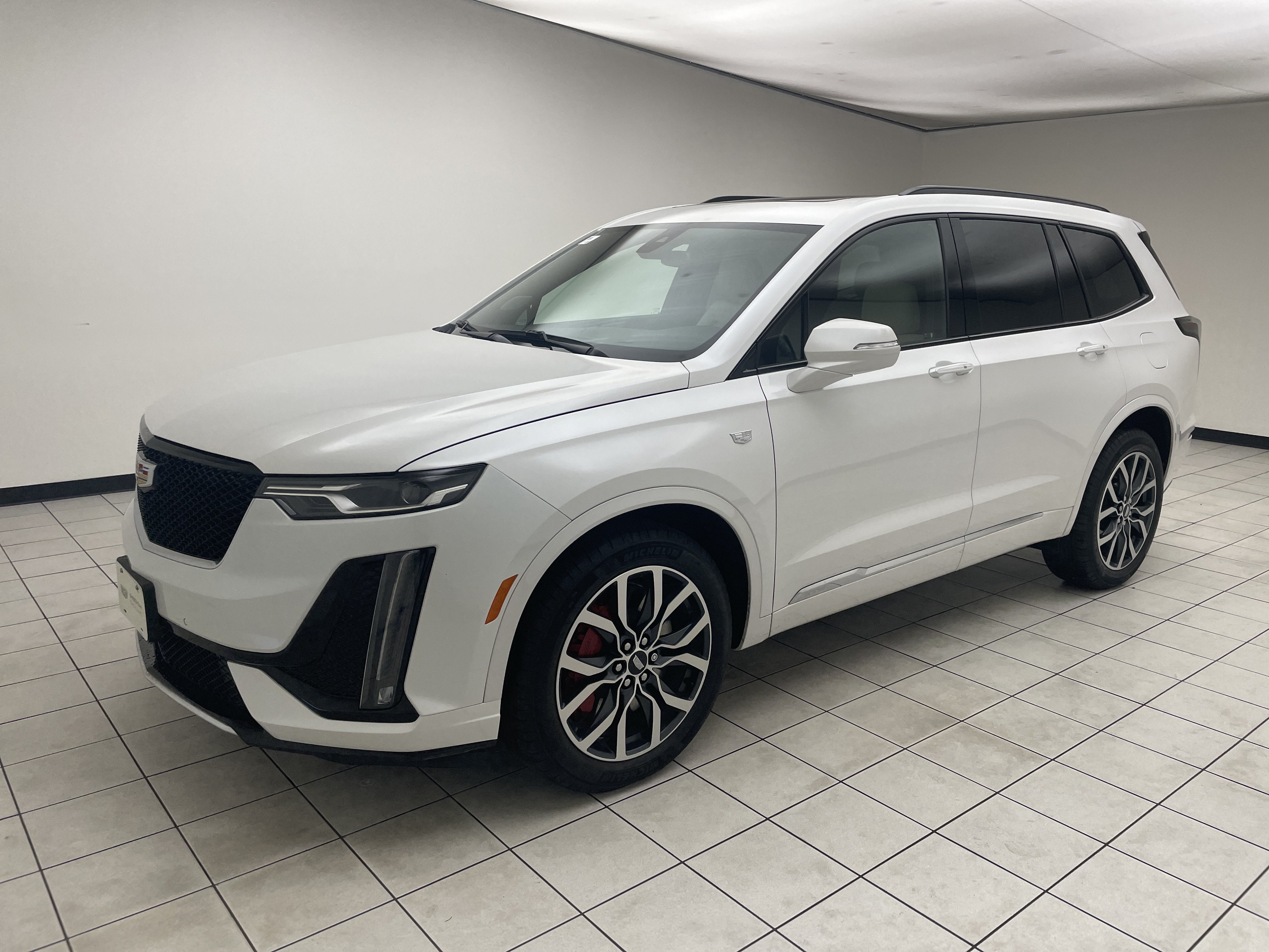 2024 Cadillac XT6 Sport in Crystal White Tricoat — front three-quarter view