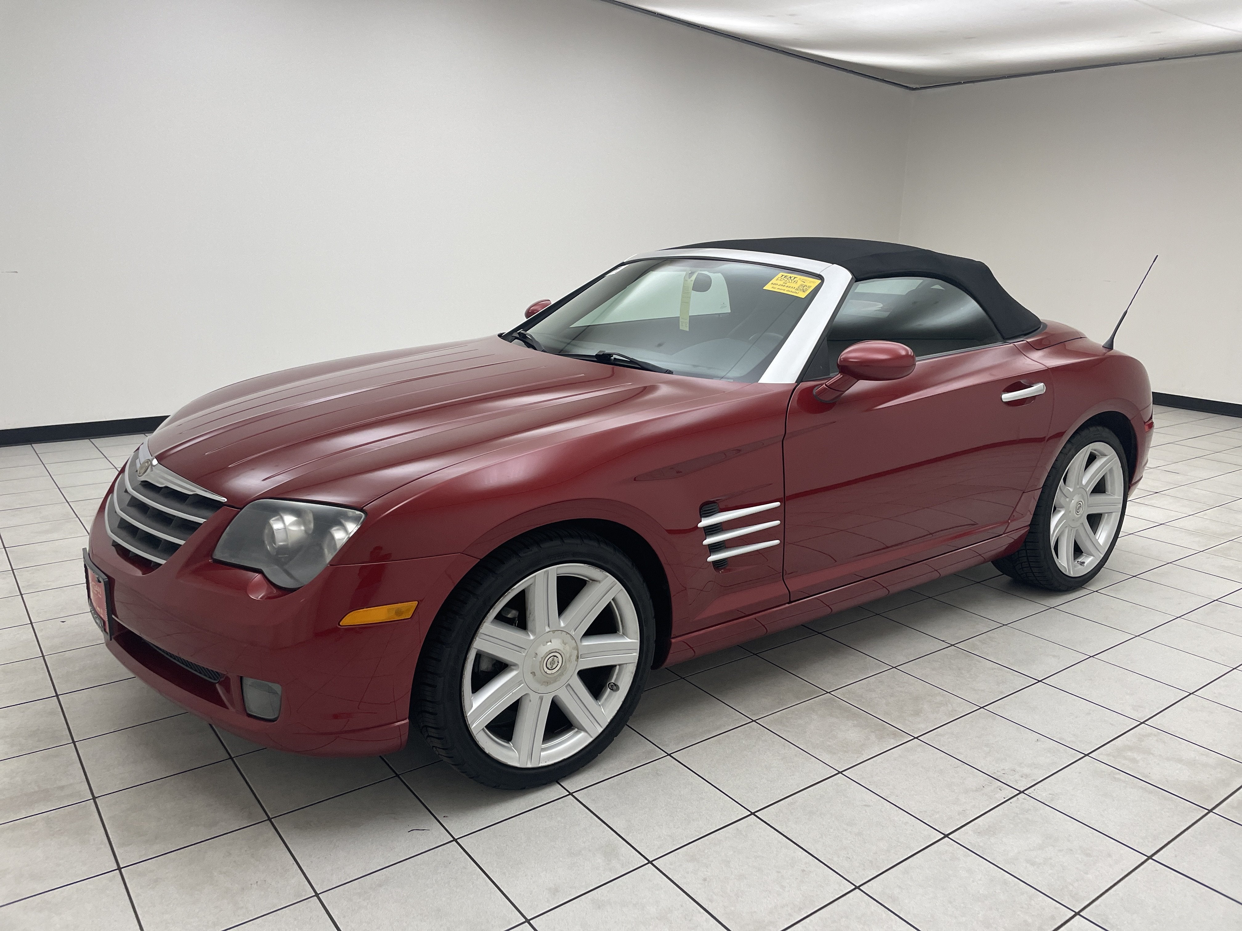 2005 Chrysler Crossfire Limited in Blaze Red Crystal Pearlcoat/Black Cloth Top — front three-quarter view