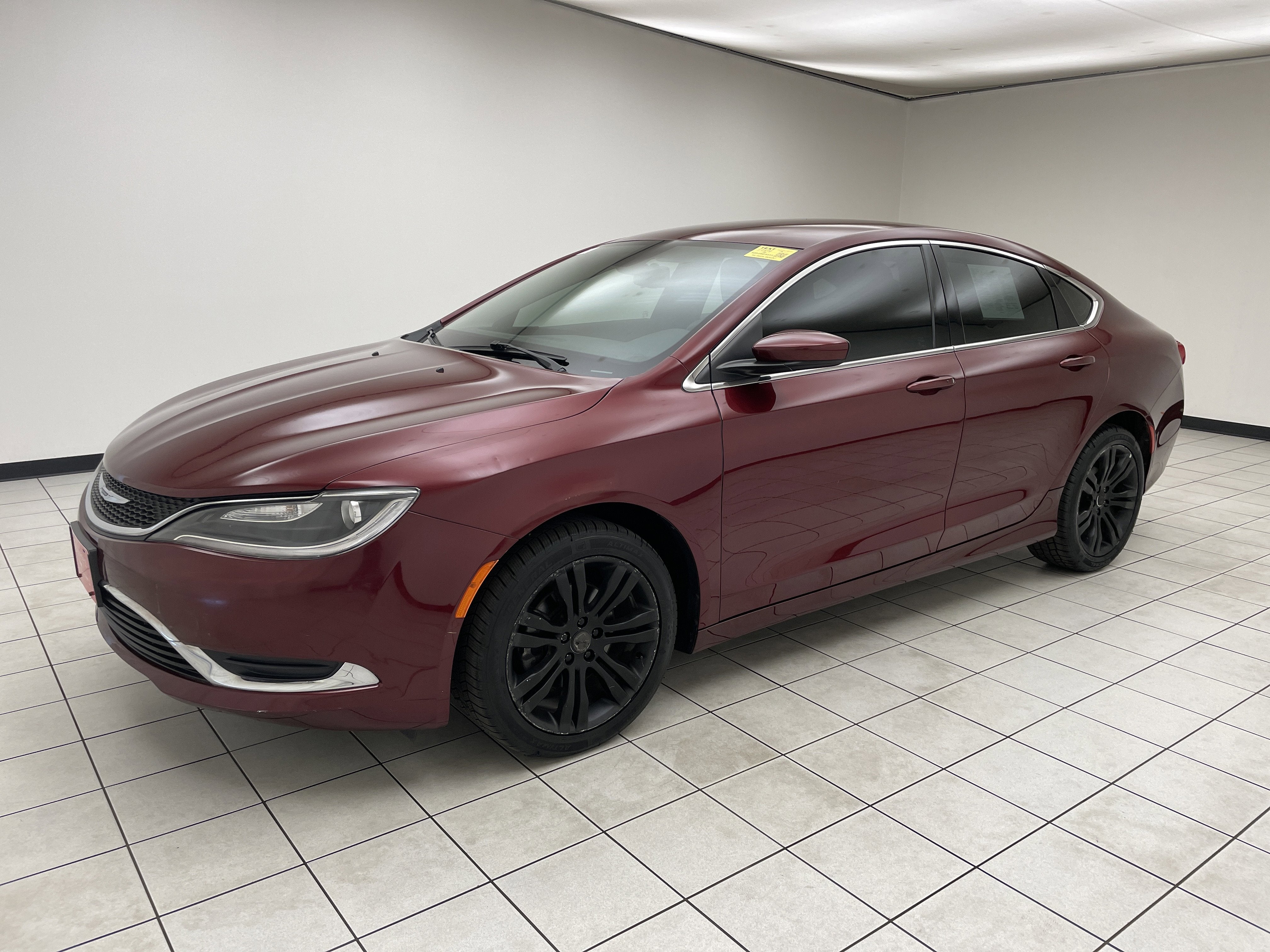 2015 Chrysler 200 Limited in Velvet Red Pearlcoat — front three-quarter view