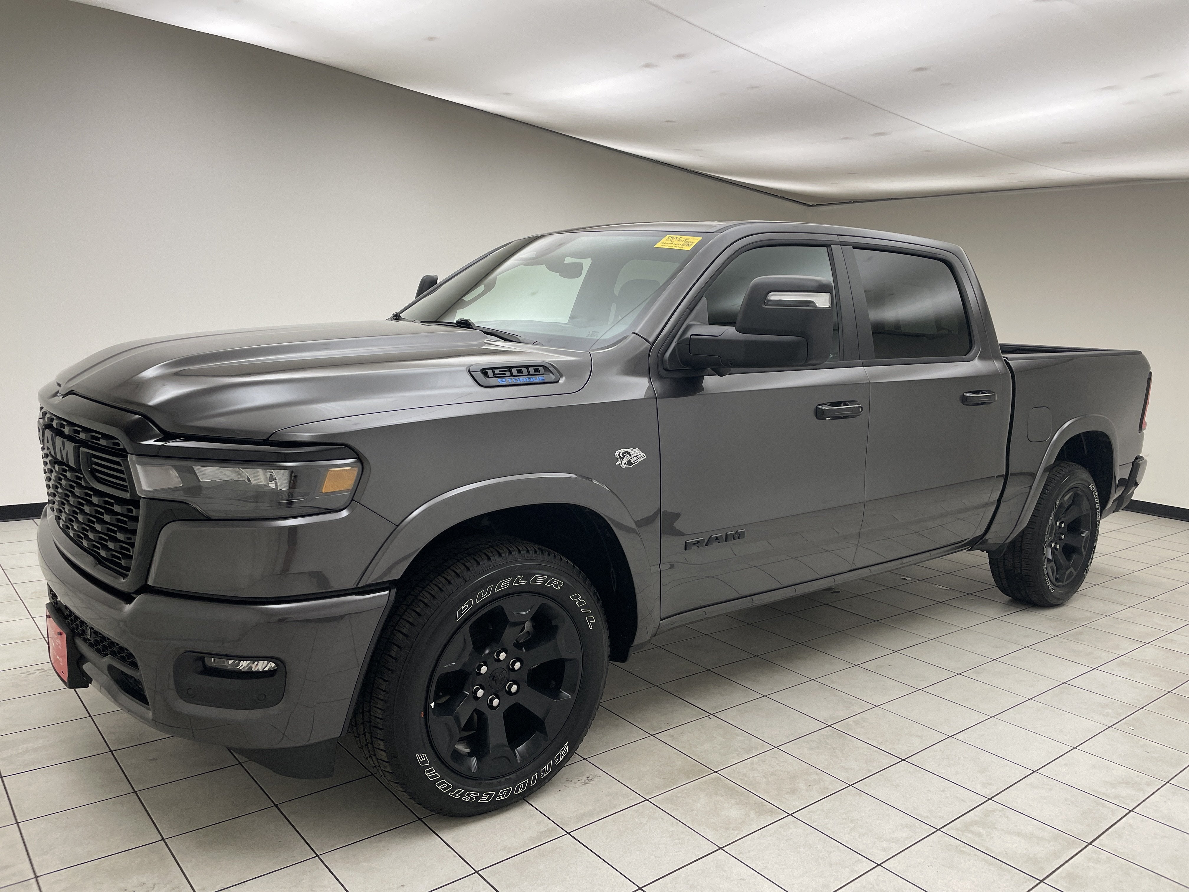 2026 RAM 1500 Big Horn Crew Cab 4x4 5'7' Box in Granite Crystal Metallic Clearcoat — front three-quarter view