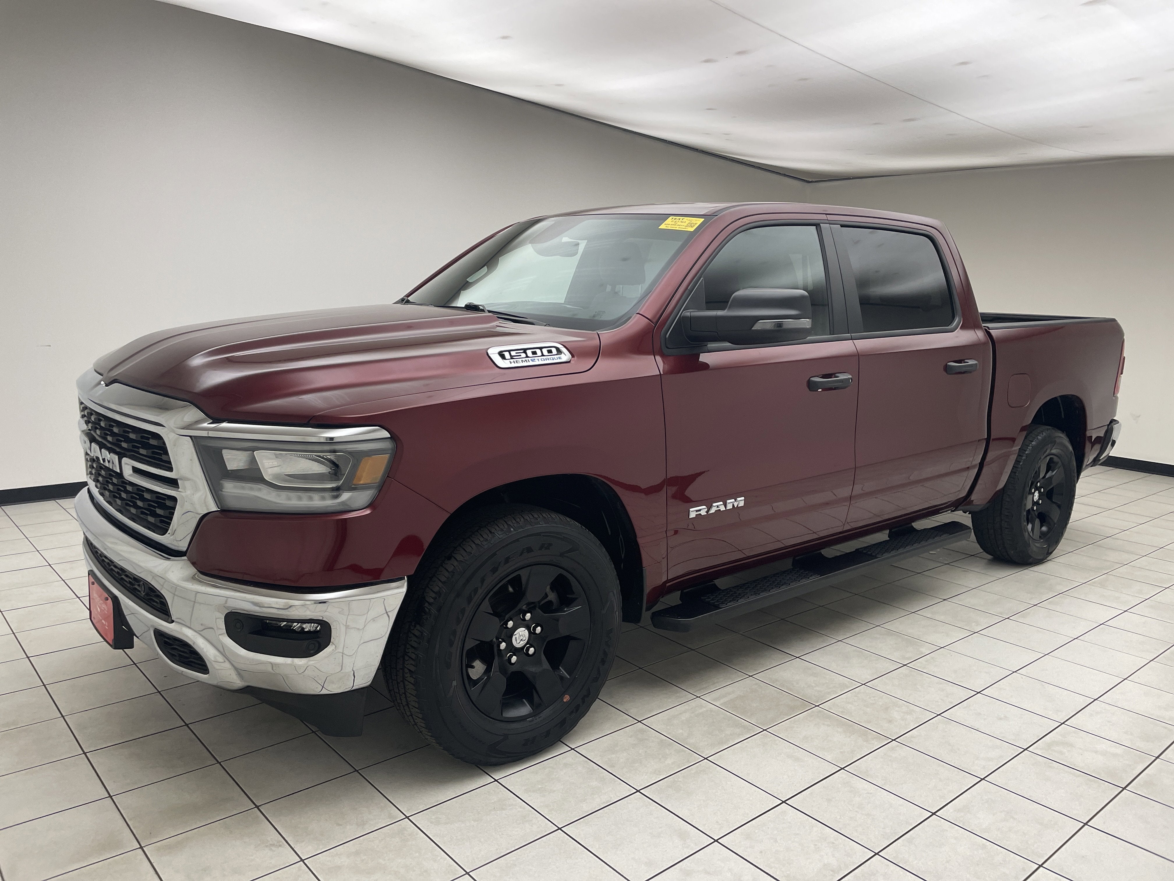 2023 RAM 1500 Big Horn Crew Cab 4x4 5'7' Box in Delmonico Red Pearlcoat — front three-quarter view