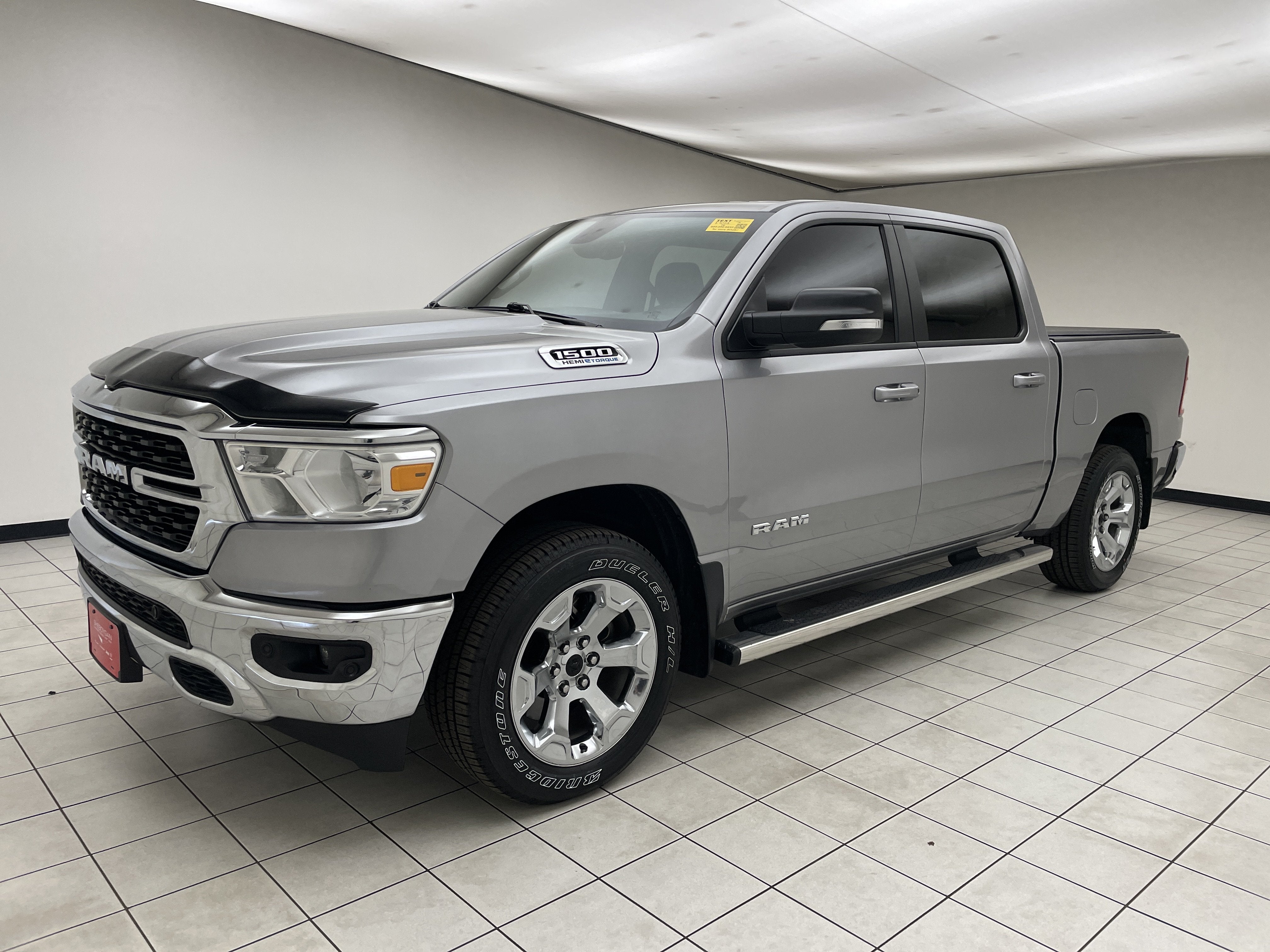 2022 RAM 1500 Big Horn Crew Cab 4x4 5'7' Box in Billet Silver Metallic Clearcoat — front three-quarter view