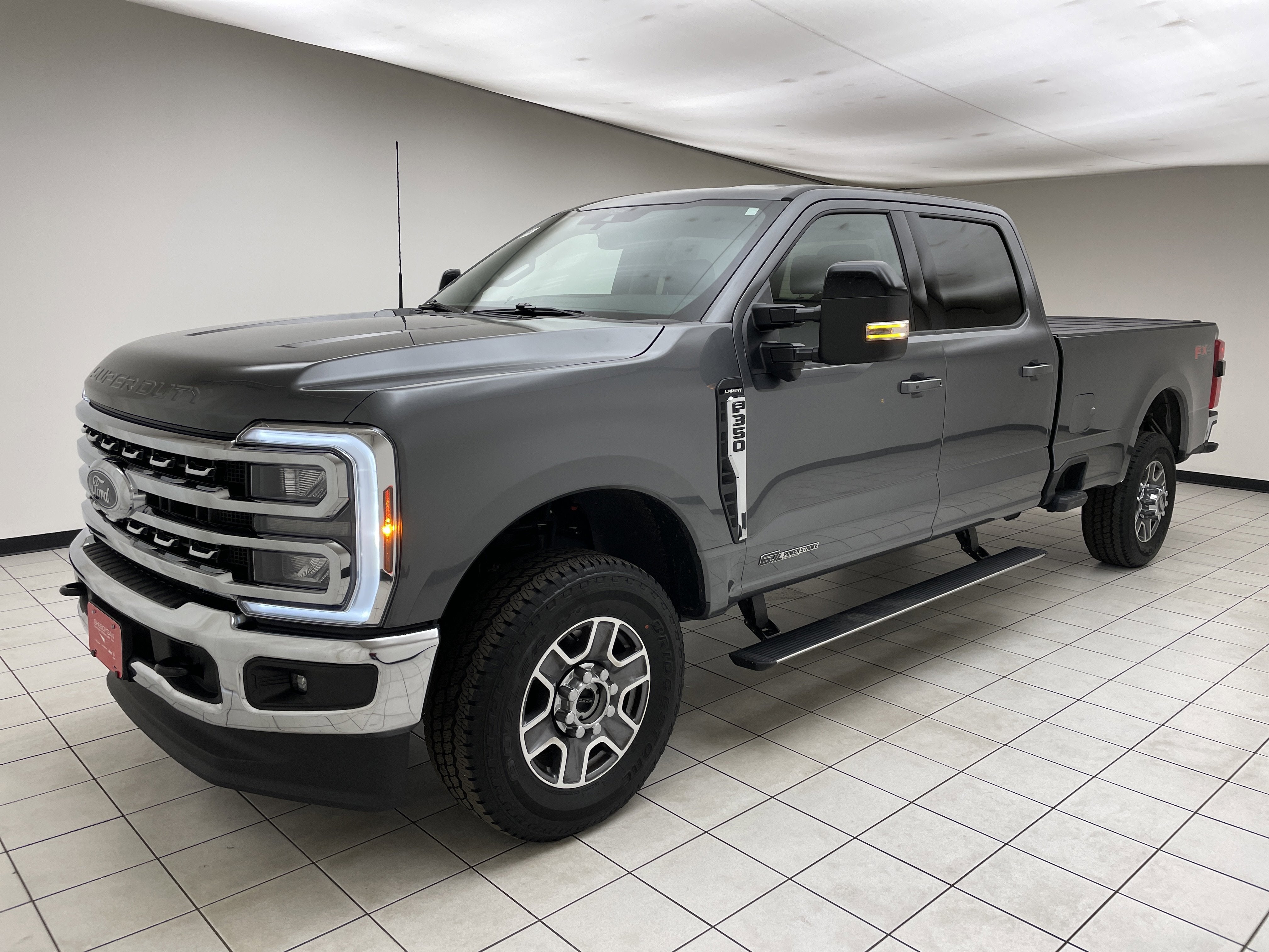 2026 Ford F-350 LARIAT in Carbonized Gray Metallic — front three-quarter view