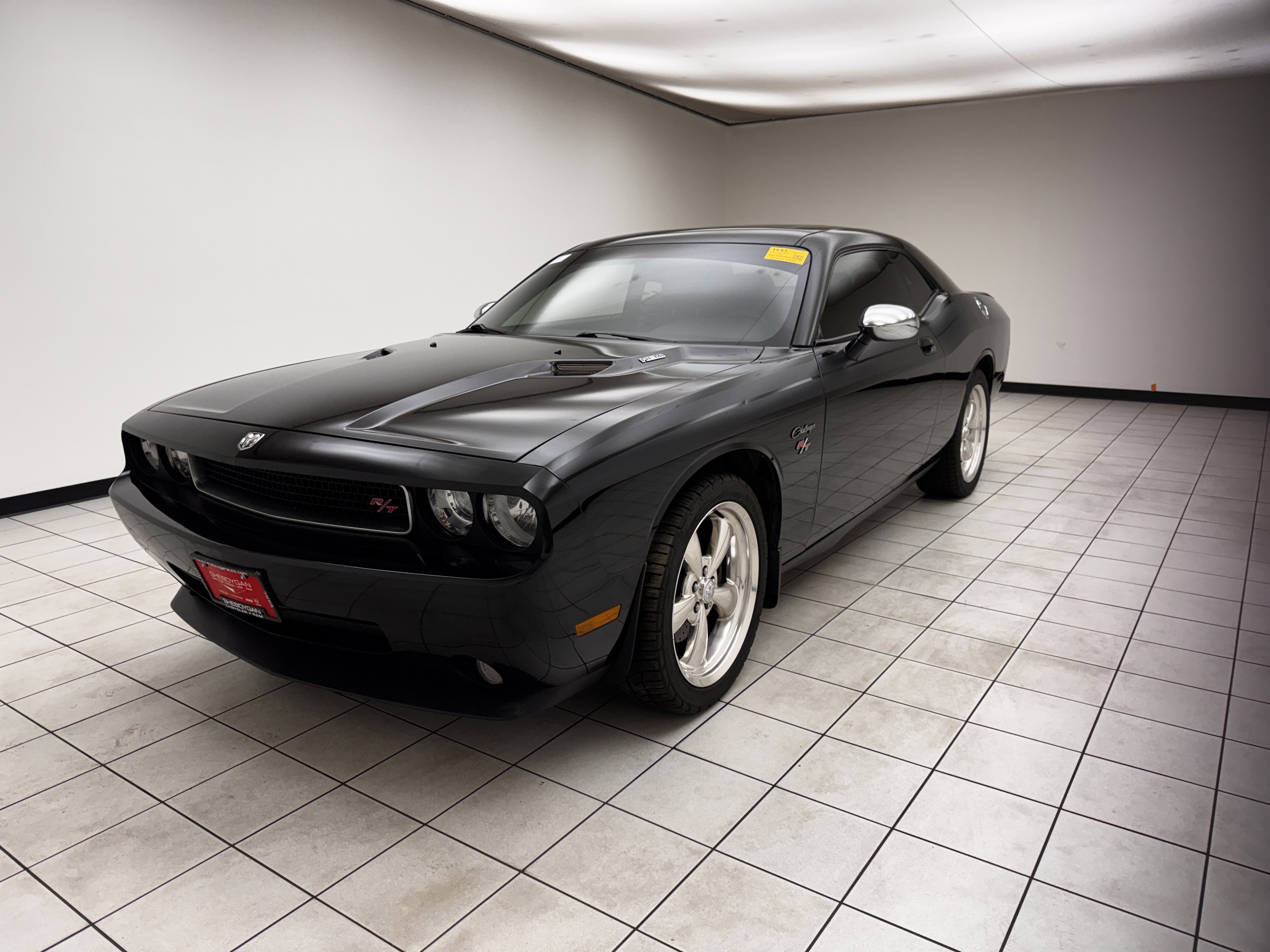 2010 Dodge Challenger R/T in Brilliant Black Crystal Pearlcoat — front three-quarter view
