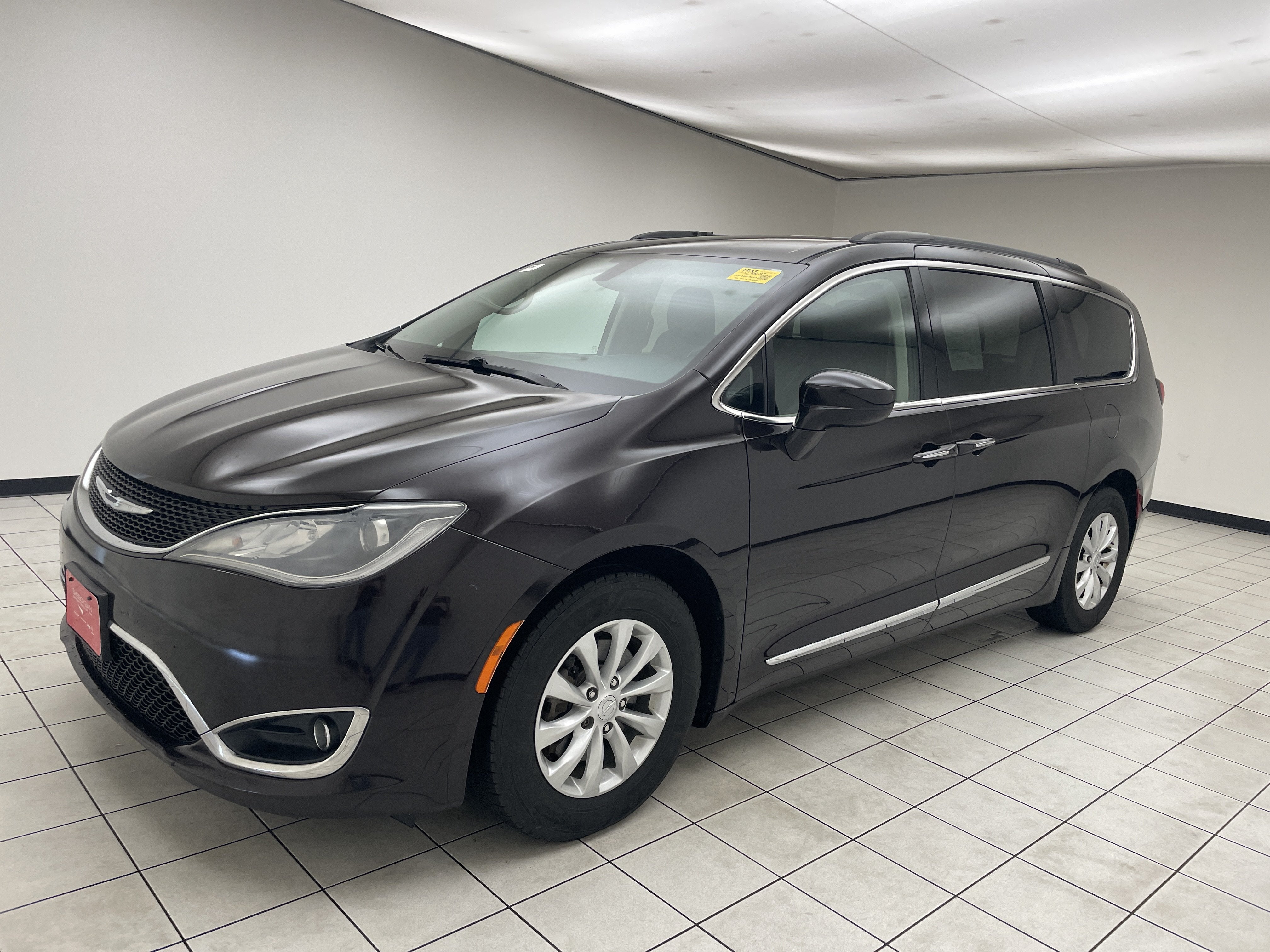 2017 Chrysler Pacifica Touring-L in Dark Cordovan Pearlcoat — front three-quarter view