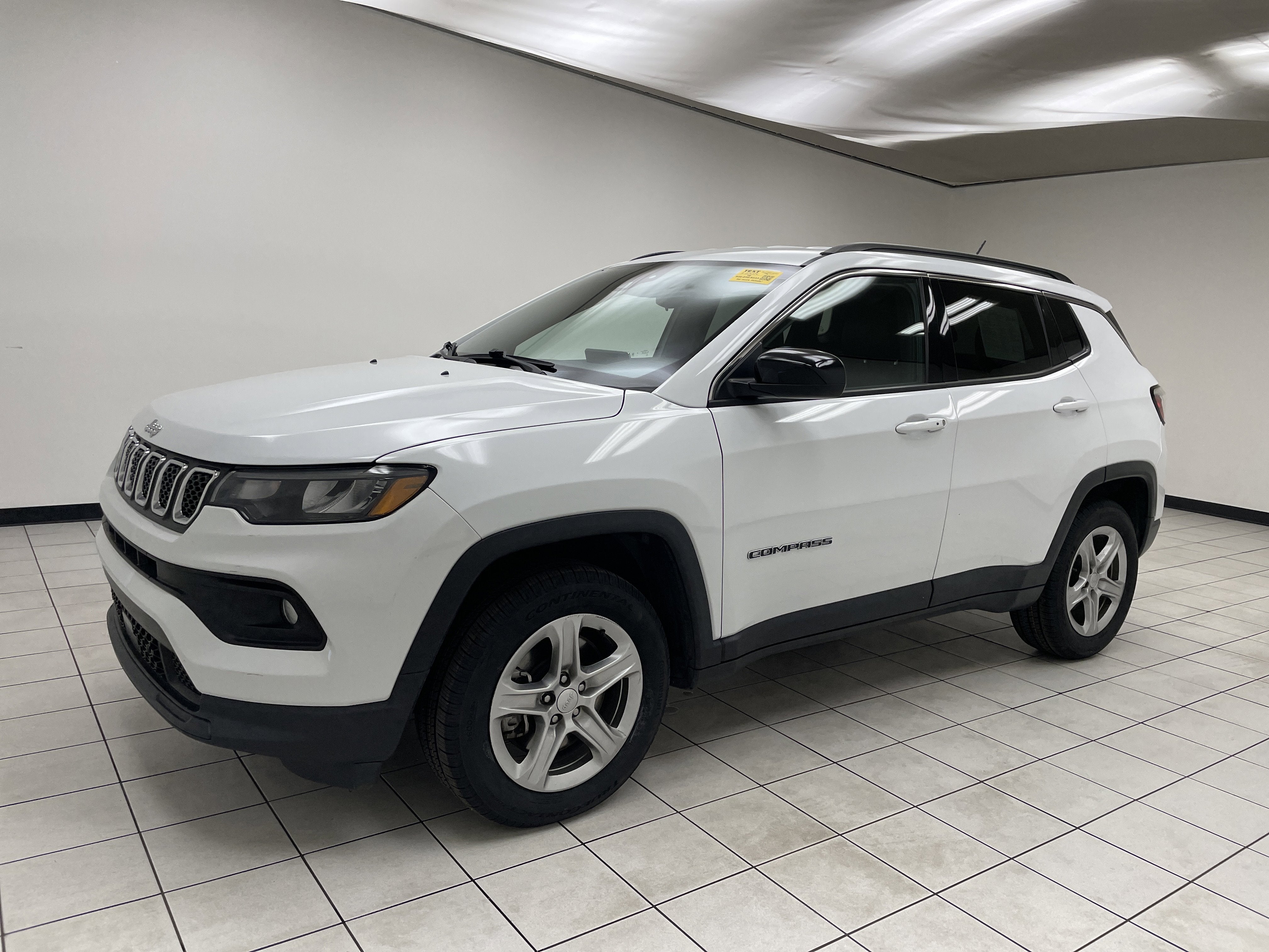 2024 Jeep Compass Latitude 4x4 in Bright White Clearcoat — front three-quarter view